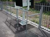 Safety barrier made from steel tube handrails covering railway station controllers