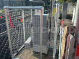 Interclamp key clamp fittings and custom mesh panels used to construct a barrier around a level crossing barrier