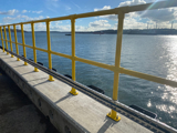 Interclamp double rail key clamp system, powder coated yellow, installed on a jetty 