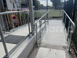Interclamp tube clamp disability compliant handrail installed on a access ramp, enabling safe and inclusive to students of the primary school.