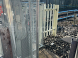 Interclamp key clamp fittings and mesh panels used to construct a custom barrier around a level crossing barrier