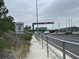 An Interclamp tube clamp handrail installed alongside a motorway to provide a segregation barrier from traffic for maintenance staff.