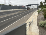 An Interclamp key clamp handrail installed alongside a motorway to provide a segregation barrier from traffic for maintenance workers.