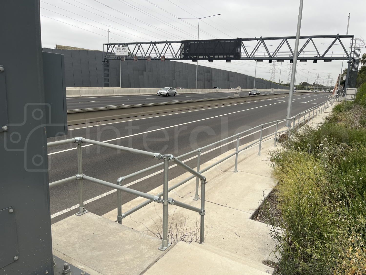 Interclamp galvanised key clamp handrail, installed next to a highway