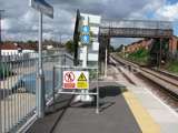 railway station with Interclamp sign holders. Railway bridge in the distance 
