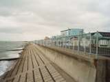 Sea front handrail system fitted to create a safety barrier for pedestrians walking along the sea wall